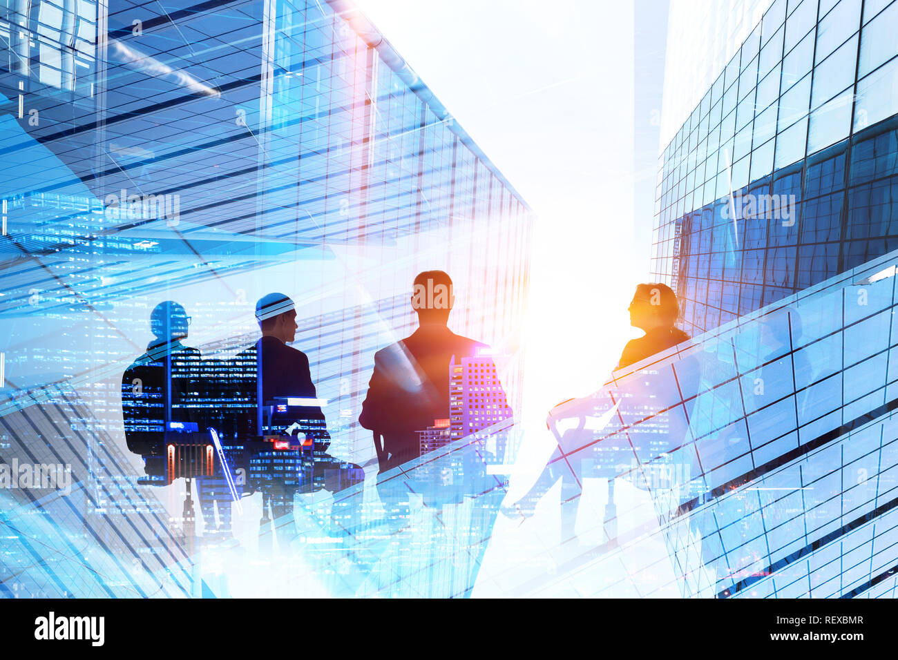 Silhouettes of business people on modern building background Stock ...