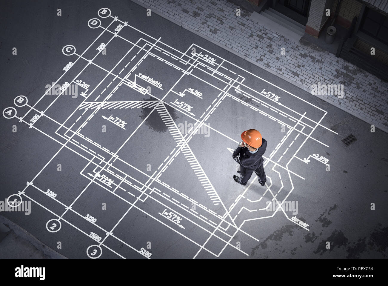 Top view of builder man and construction drawings on floor. Mixed media ...