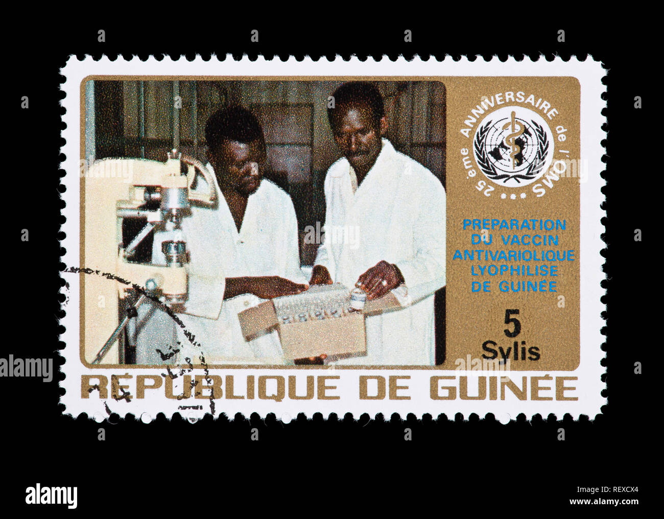 Postage stamp from Guinea but depicting aassempbly of vaccine and vaccination gun and the WHO emblem. Stock Photo