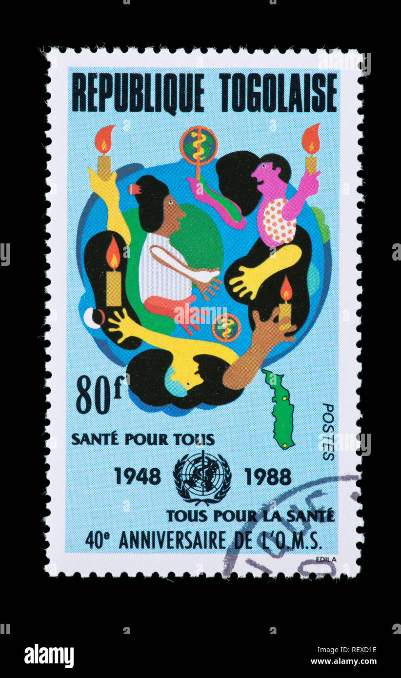 Postage stamp from Togo depicting emblems for WHO and playing children, fortieth anniversary. Stock Photo