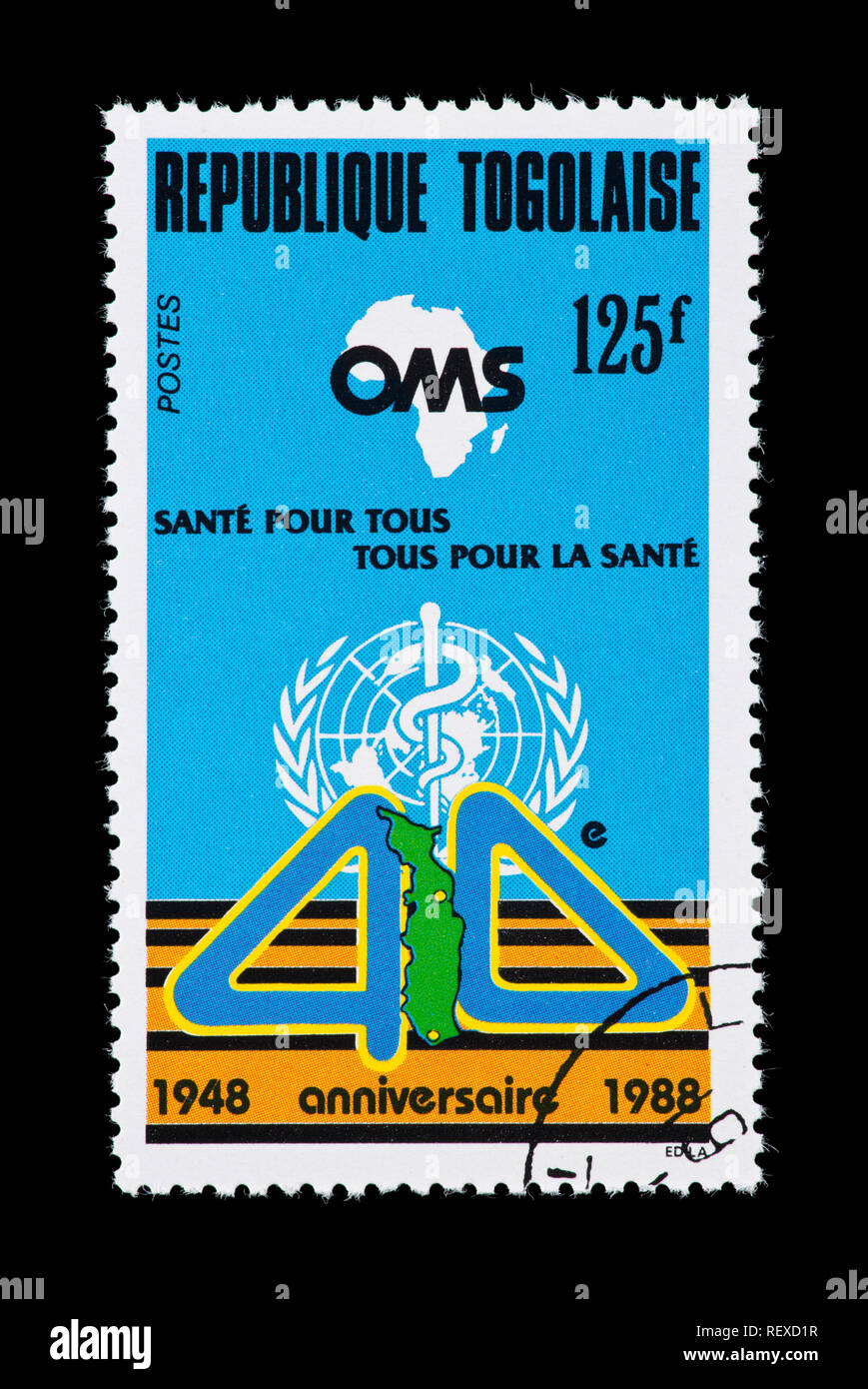 Postage stamp from Togo depicting emblems for WHO, fortieth anniversary. Stock Photo