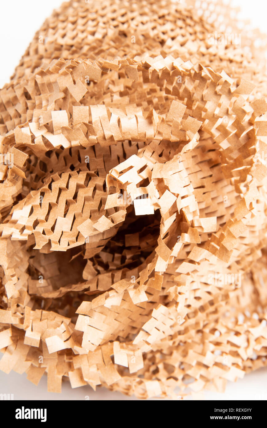 A bunched up and crumpled recyclable brown paper filler and packaging