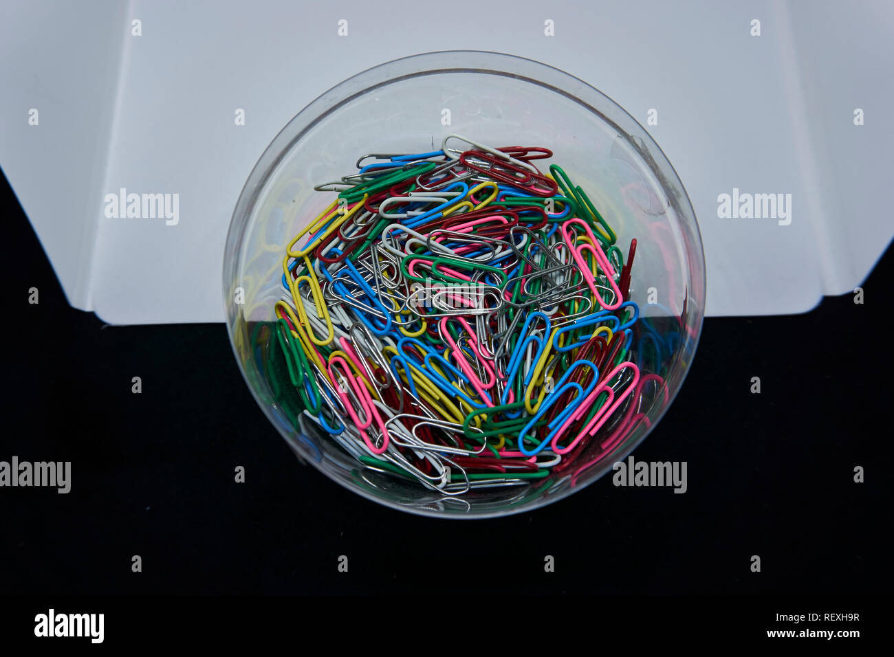 colourfull paperclips with a black and white background Stock Photo