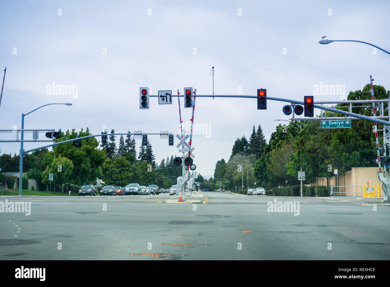 August 3, 2017 Sunnyvale/CA/USA - Railway crossing at a street junction near a residential neighborhood in Silicon Valley Stock Photo