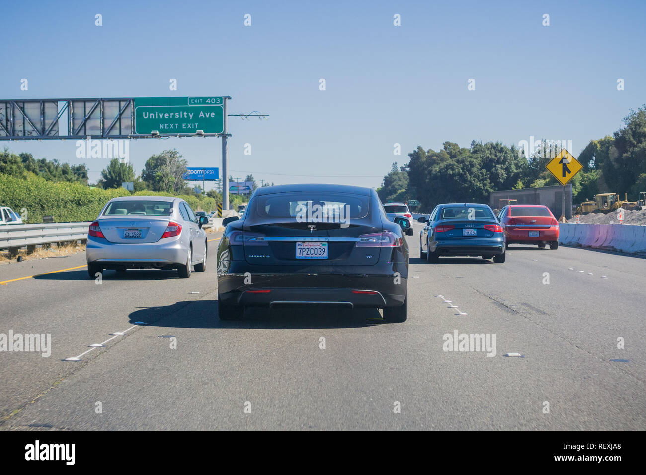 October 7, 2017 Palo Alto/CA/USA - Black Tesla Model S 70 driving on the freeway in San Francisco bay area Stock Photo