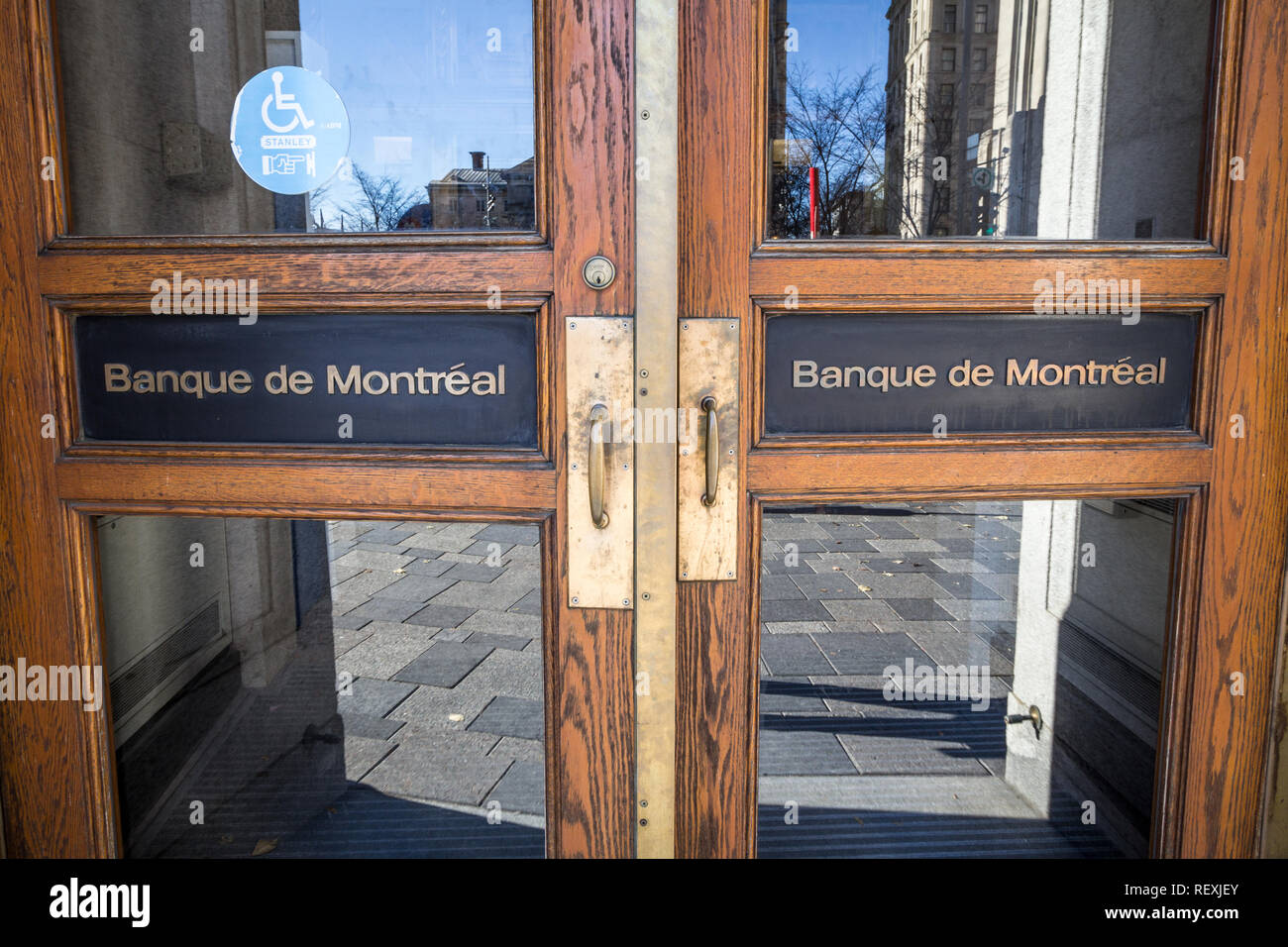 MONTREAL, CANADA - NOVEMBER 4, 2018: Bank of Montreal logo, known as BMO, on the doors of their historical office in Old Montreal. Called banque de Mo Stock Photo