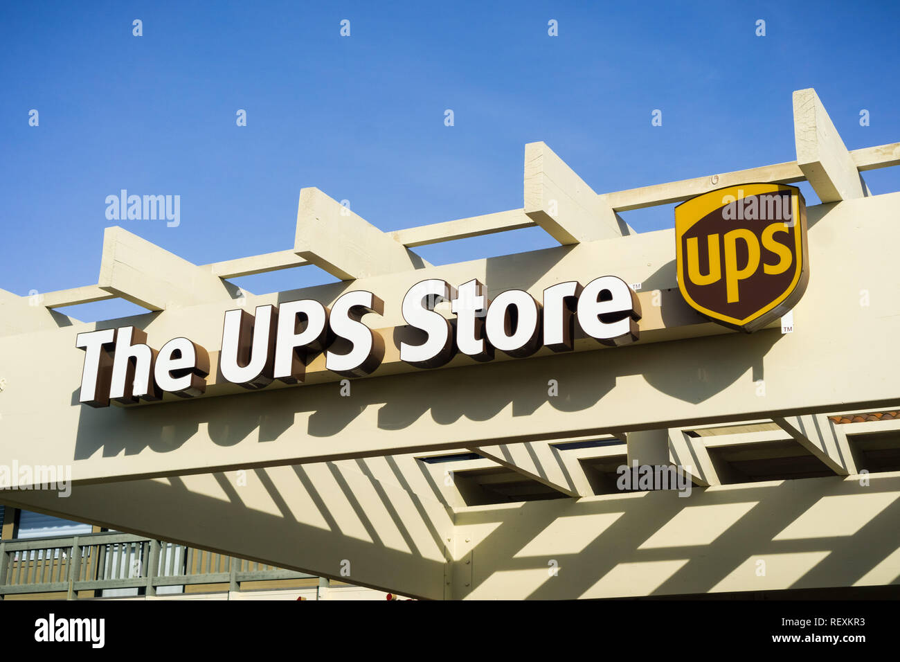 December 22, 2017 Sunnyvale / CA / USA - The UPS store logo placed above the to one of their Santa Clara county locations, San Francisco bay area Stock Photo