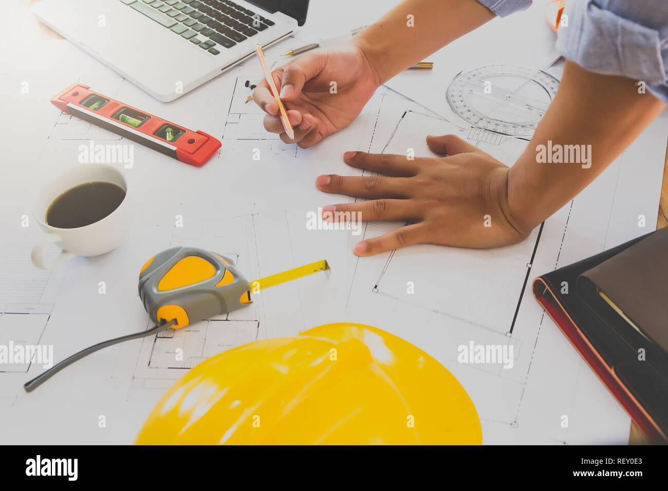 Architect or engineer working on blueprint in office, architectural concept Stock Photo