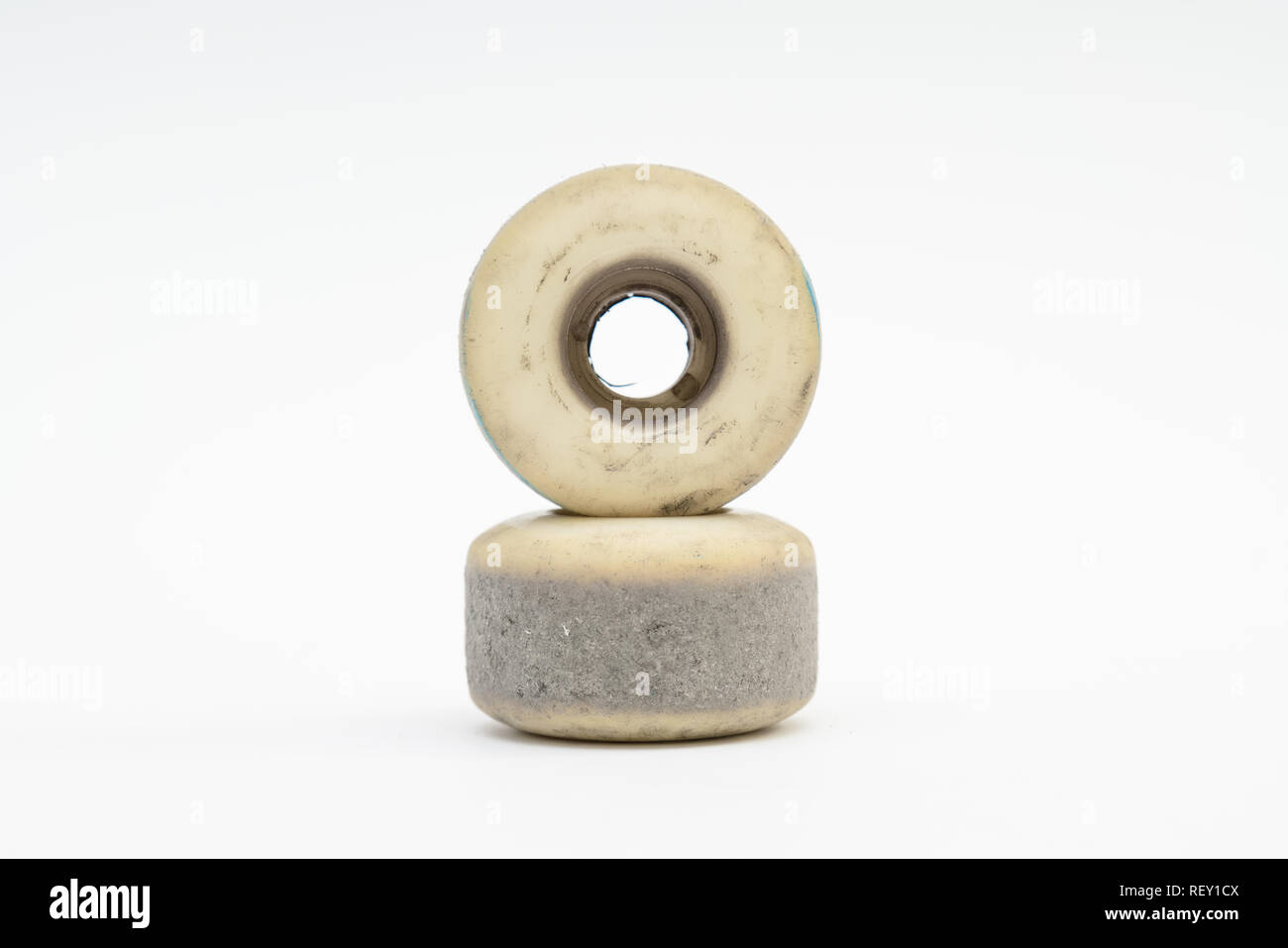Close up of a skateboard wheel on white background. Complete skateboard