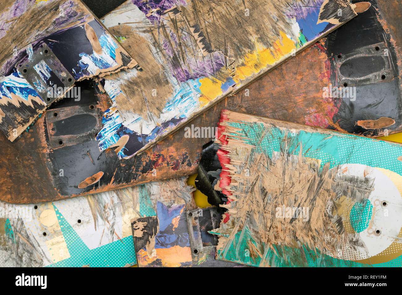 Broken colourful skateboard decks stacked on top of each other, skateboard recycling Stock Photo