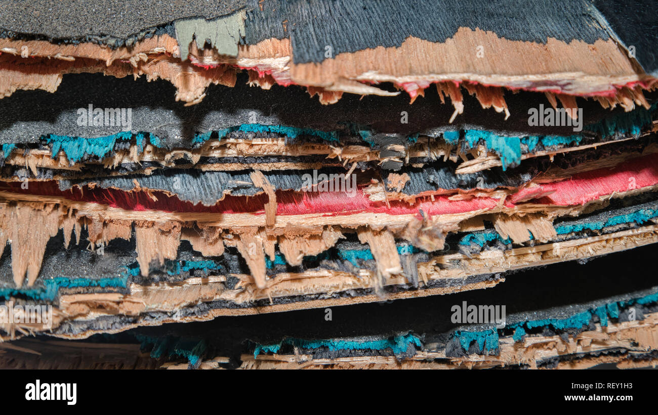 Broken colourful skateboard decks stacked on top of each other, skateboard recycling Stock Photo