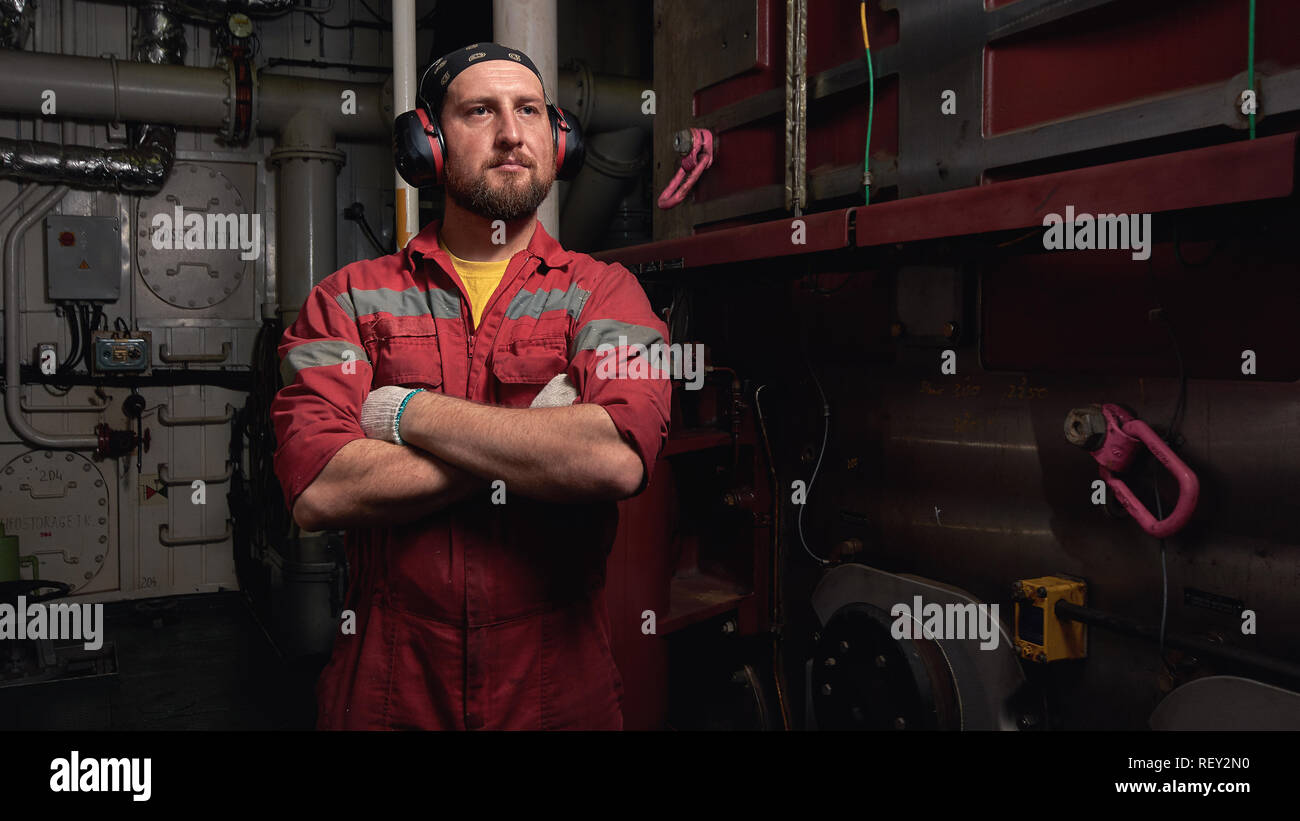 Mechanic ship main engine on dark background. Industrial marine engine