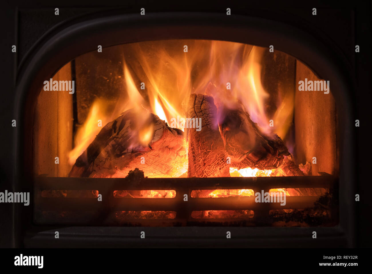 Burning Fireplace With Wooden Logs Burning Inside Warm Light