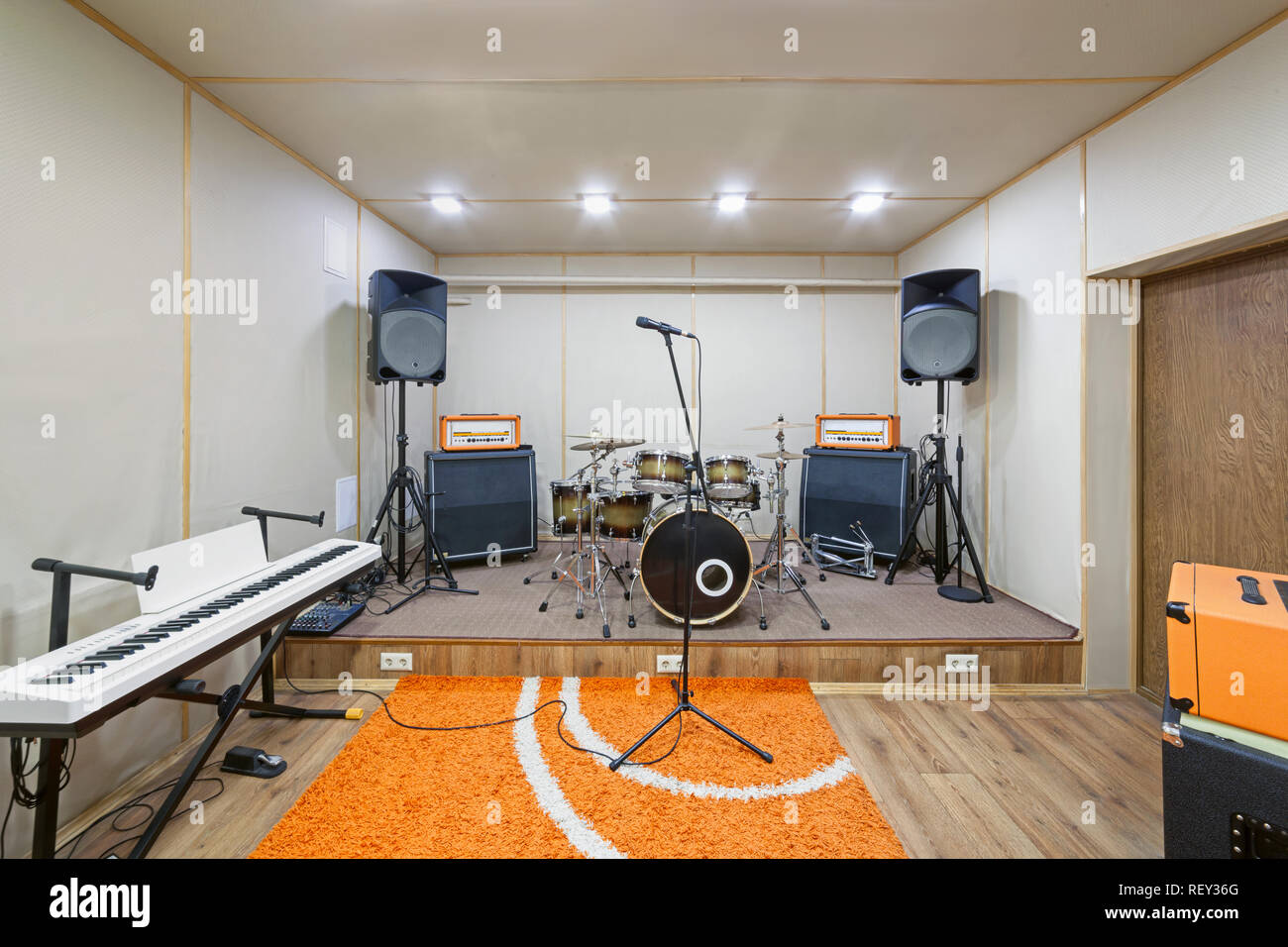 Music rehearsal space with drum kit and musical equipment. Stock Photo