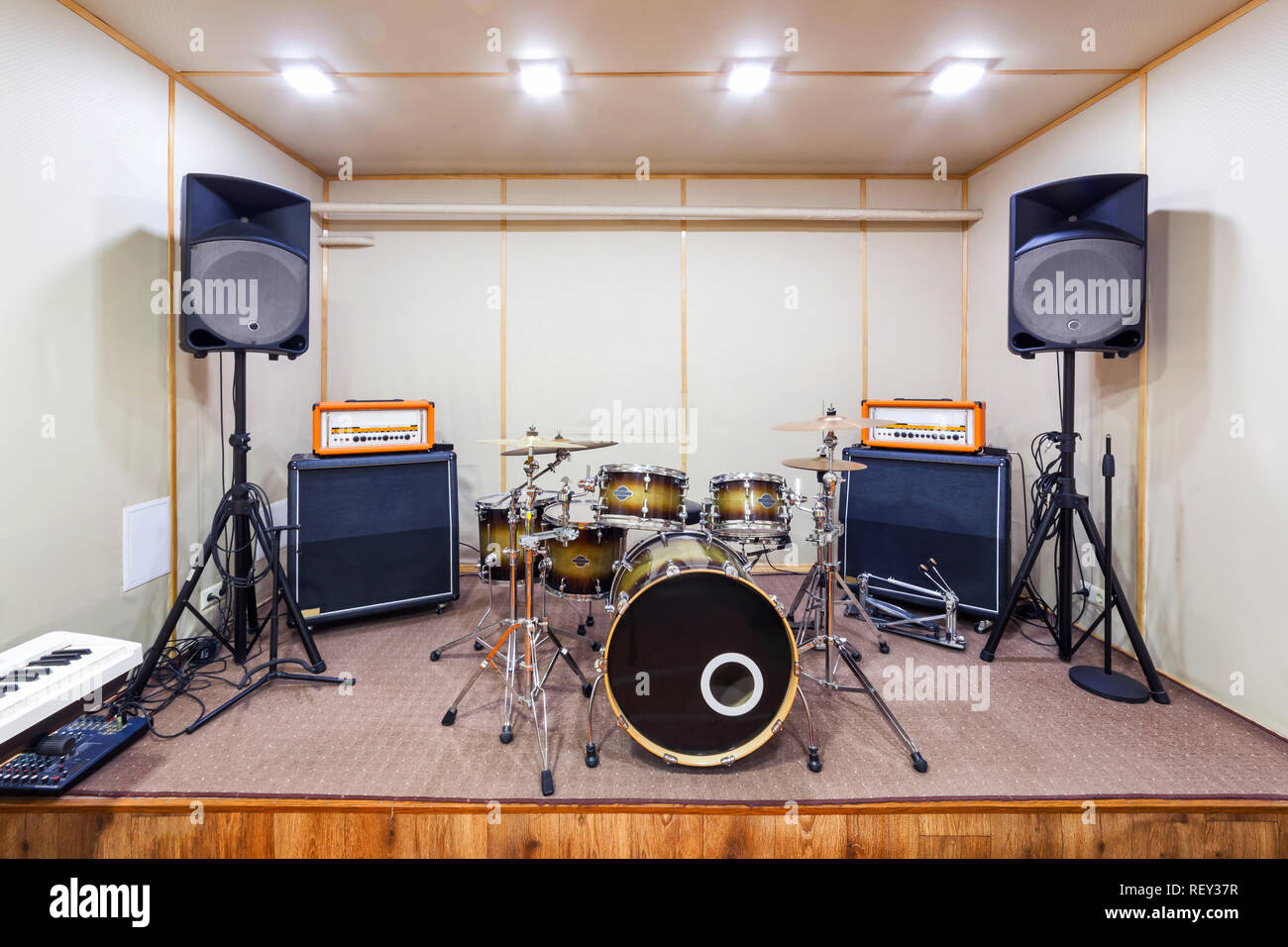 Music rehearsal space with drum kit and musical equipment Stock Photo