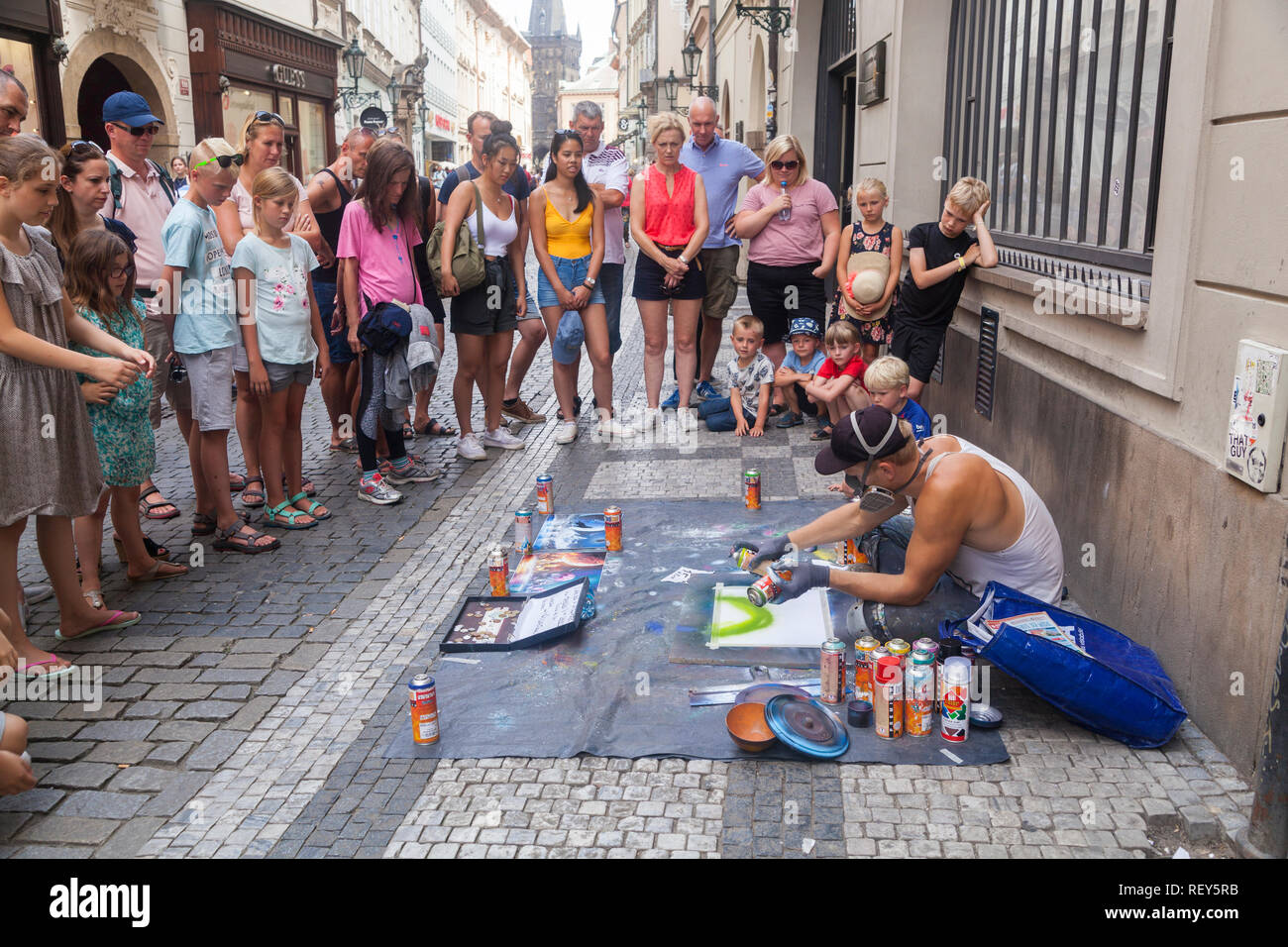 Prague, Czech Republic - July 16 2018: A street artist painting with