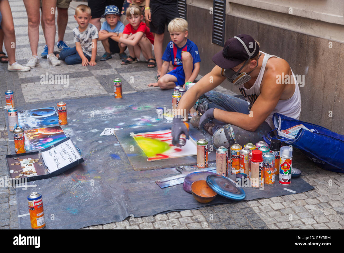 Prague, Czech Republic - July 16 2018: A street artist painting with