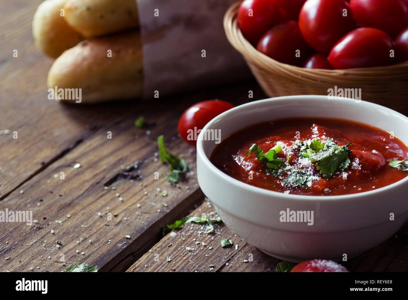 Fresh Marinara Pizza sauce in a bowl on wooden background, selective focus Stock Photo