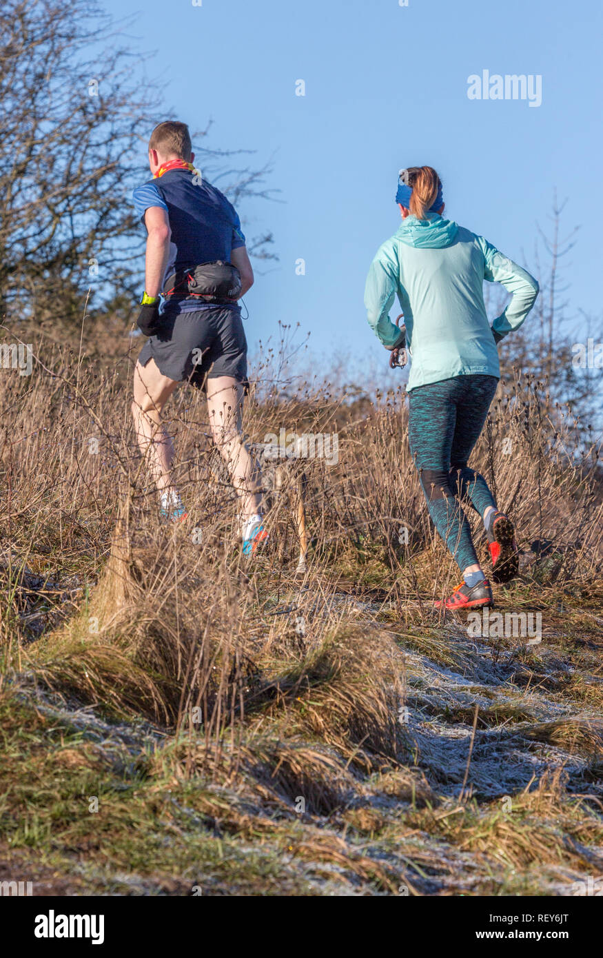 Fell Runners on the Cumbrian Fells in the English Lake District during Winter Stock Photo