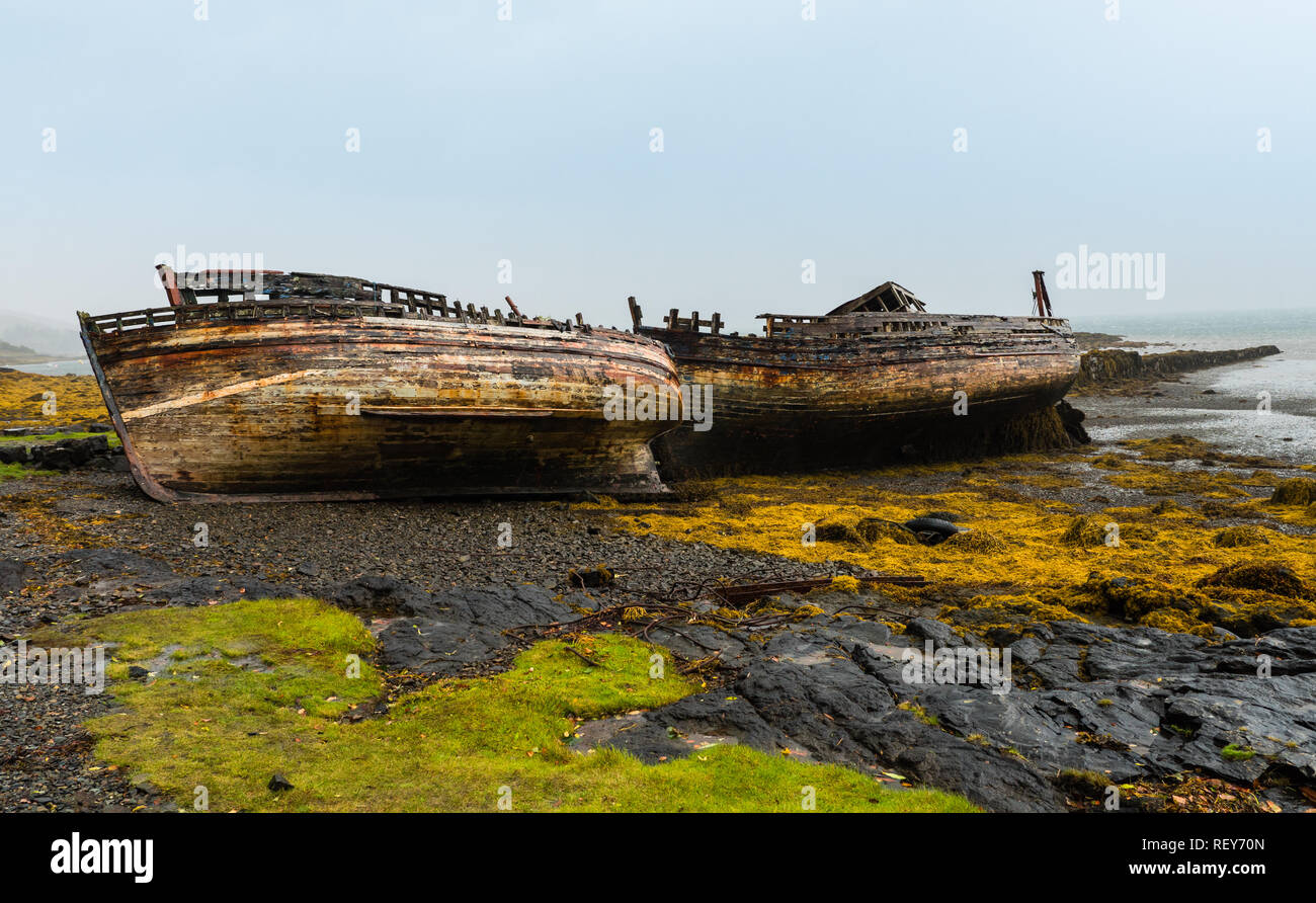 Shipwrecked fishing boats on the Scottish isle of Mull Stock Photo