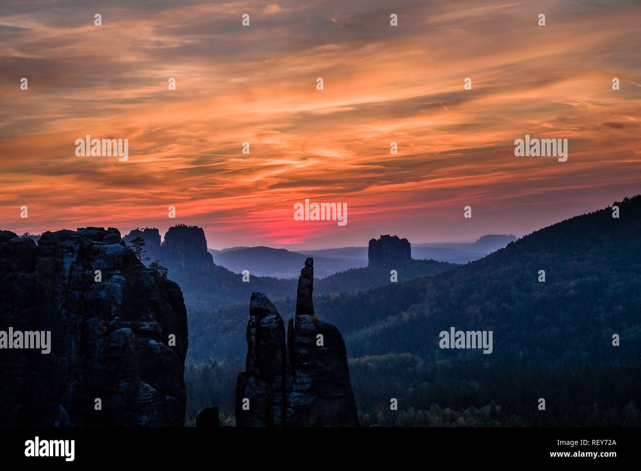 Landscape in the National Park Sächsische Schweiz with rock formations at sunset Stock Photo