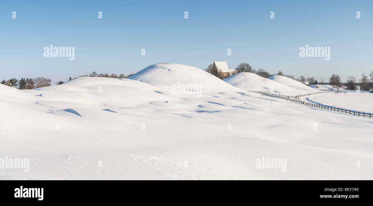 Old Uppsala (Gamla Uppsala) Royal burial mounds in the winter. Uppsala, Sweden. Scandinavia. Stock Photo