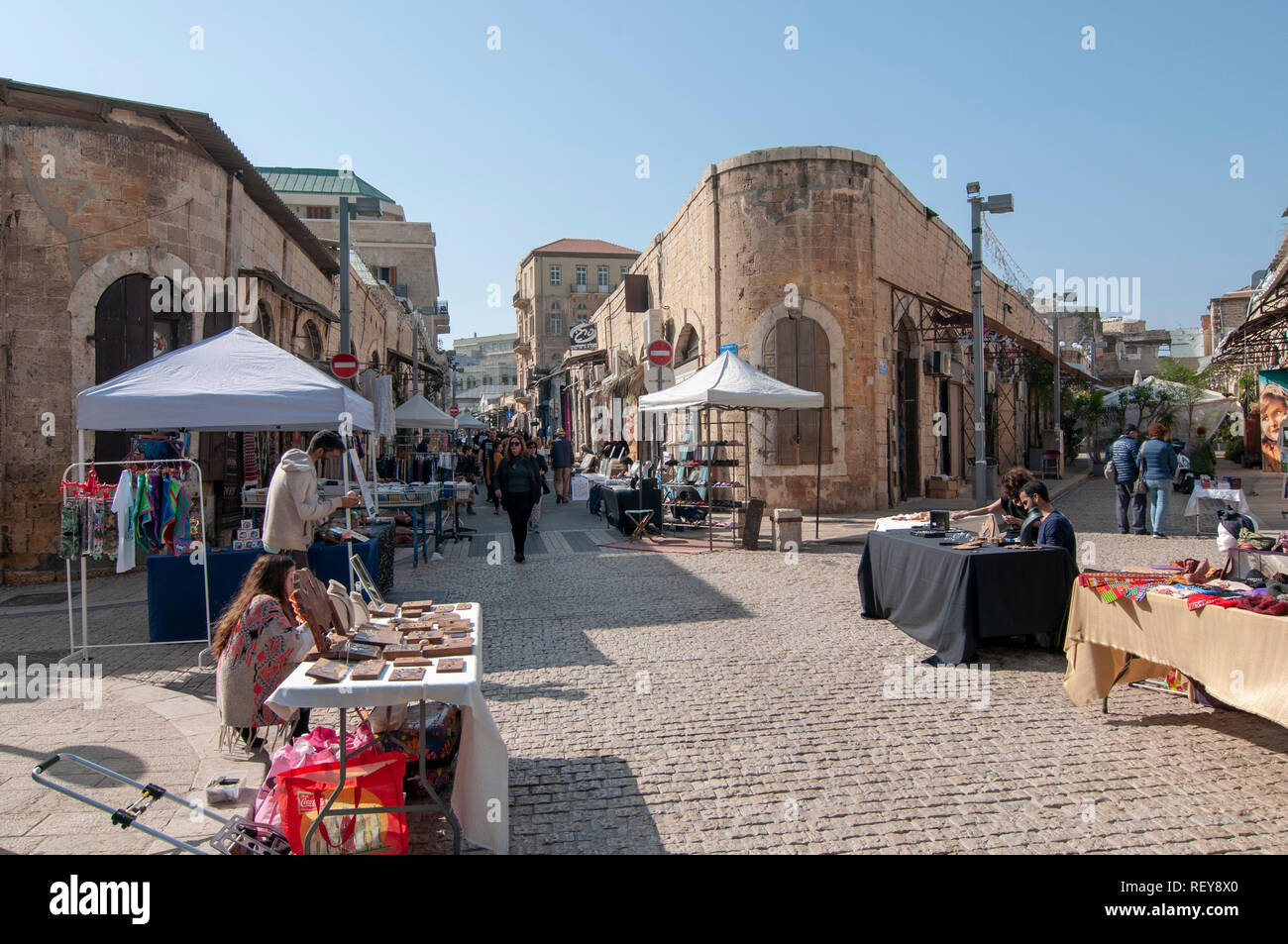 handcrafts and art for sale on stall in the weekly fair at the Greek Market, Jaffa, Israel Stock Photo