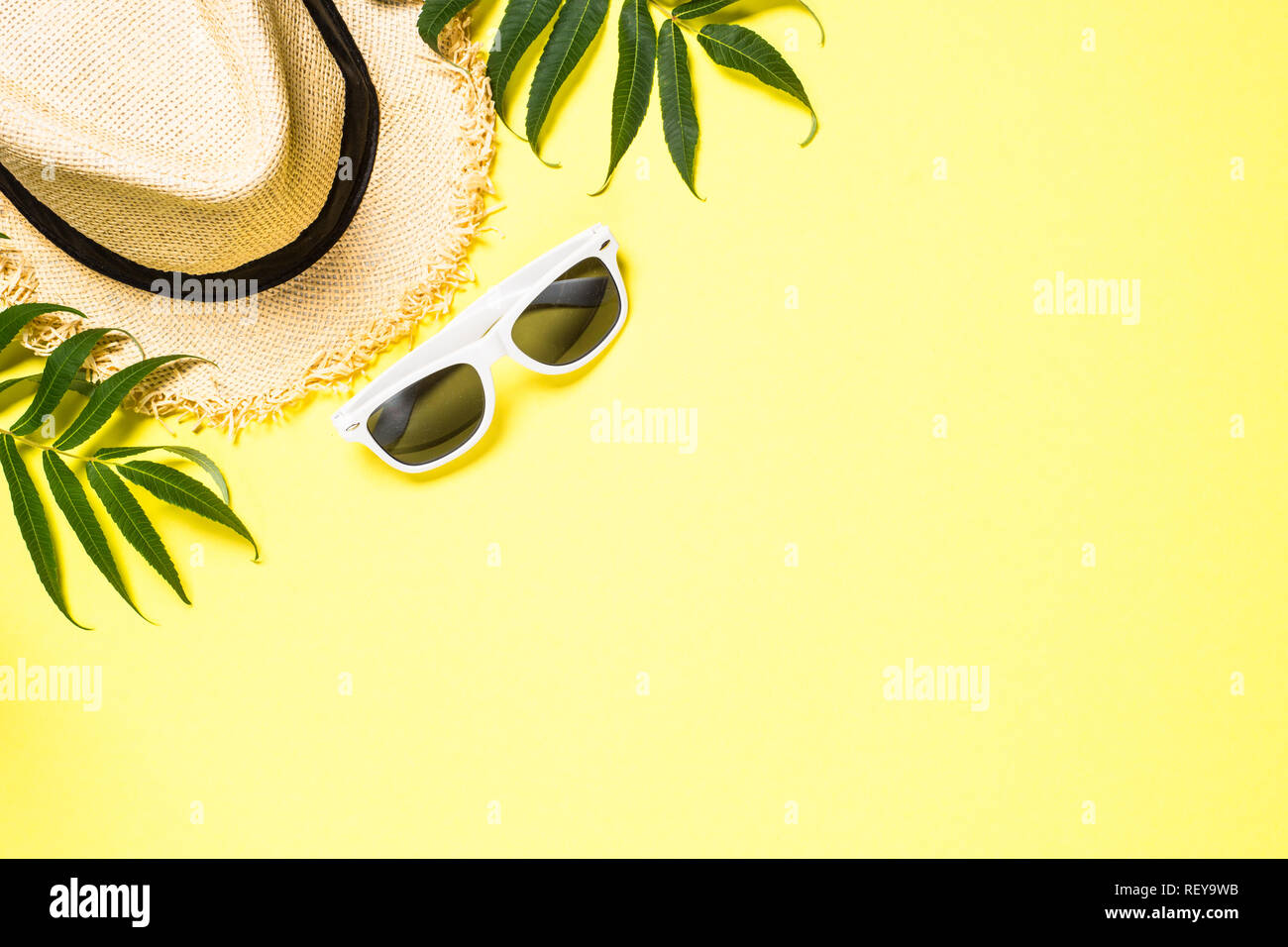 Summer travel vacation background. Hat and sunglasses on yellow ...