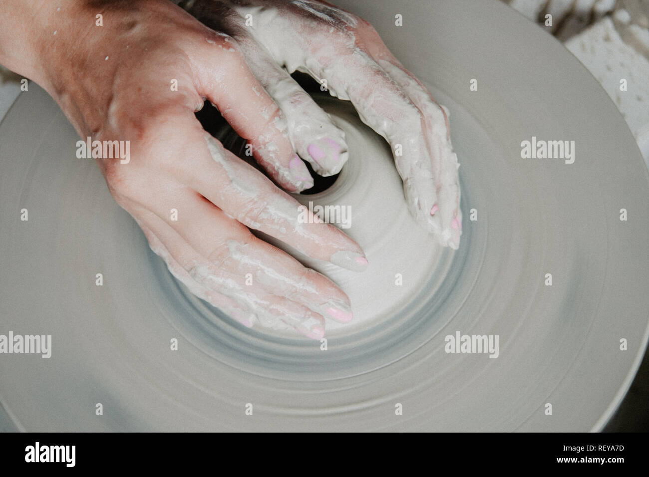 Top view of clay products, on a pottery wheel with copy space, closeup Stock Photo