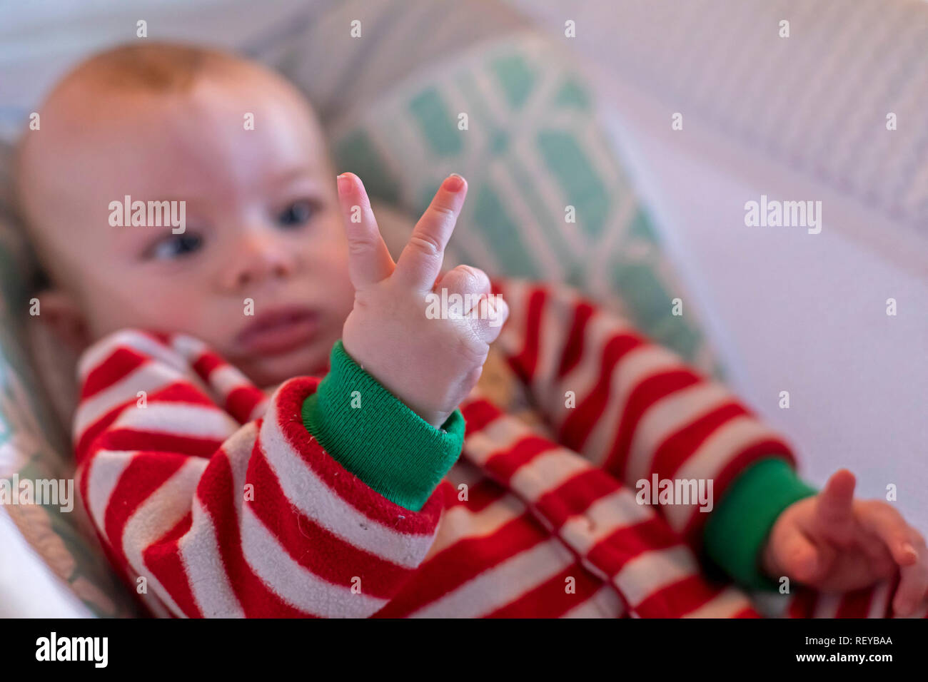 Denver, Colorado - Four-month-old Hendrix Hjermstad studies his fingers. Stock Photo