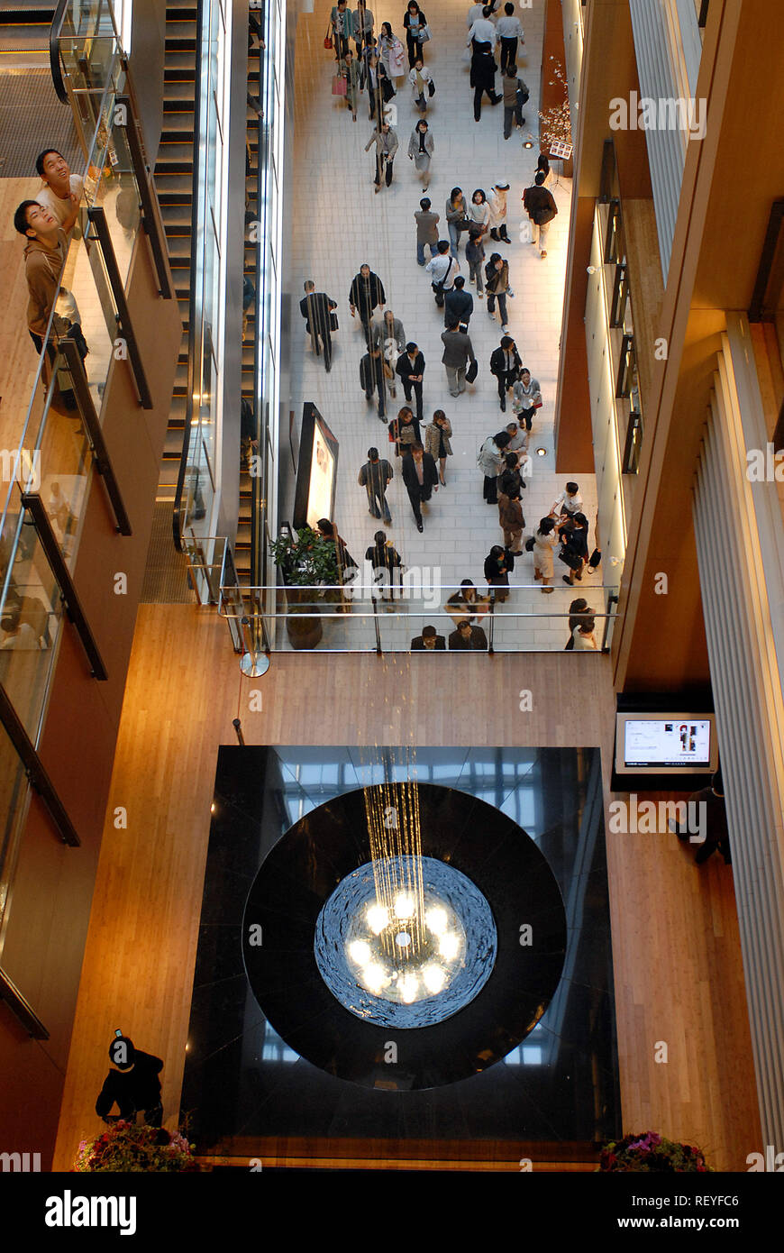 Visitors make their way around the Tokyo Midtown shopping and office complex, which opened in Tokyo on Friday, 30 Mar., 2007.  Photographer: Robert Gi Stock Photo