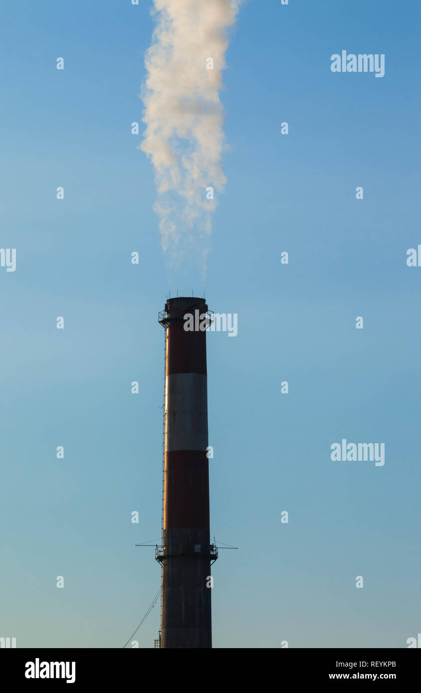 A smoke stack discharging smoke or steam in south Seattle, Washington,  USA Stock Photo