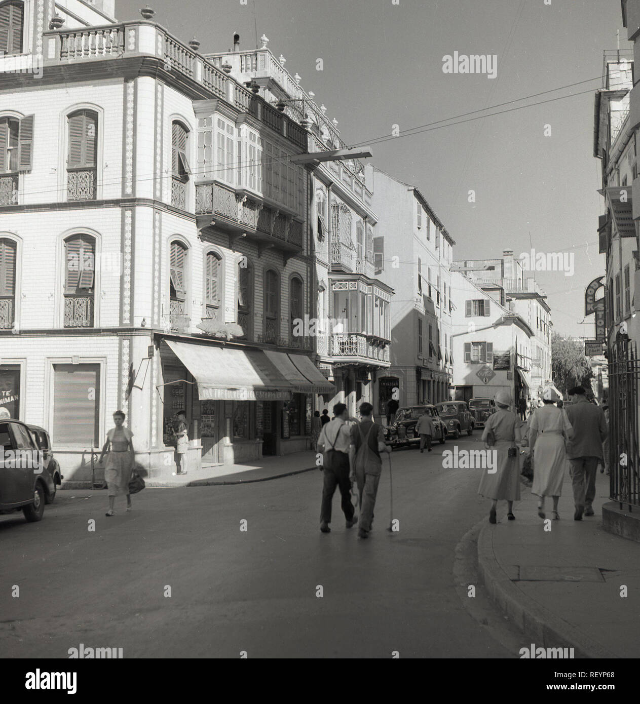 1950s, historical, people in a street in the old town, Gibraltar, a British Overseas Territory on Spain's south coast. As can be seen, the buidings are distinctively spanish in style, although the territory was ceded to the British in perpetuity in 1713. Stock Photo