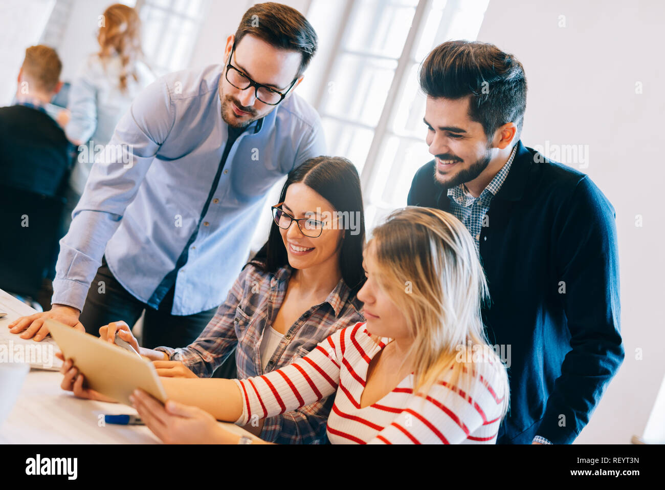 Group of young architects using digital tablet Stock Photo
