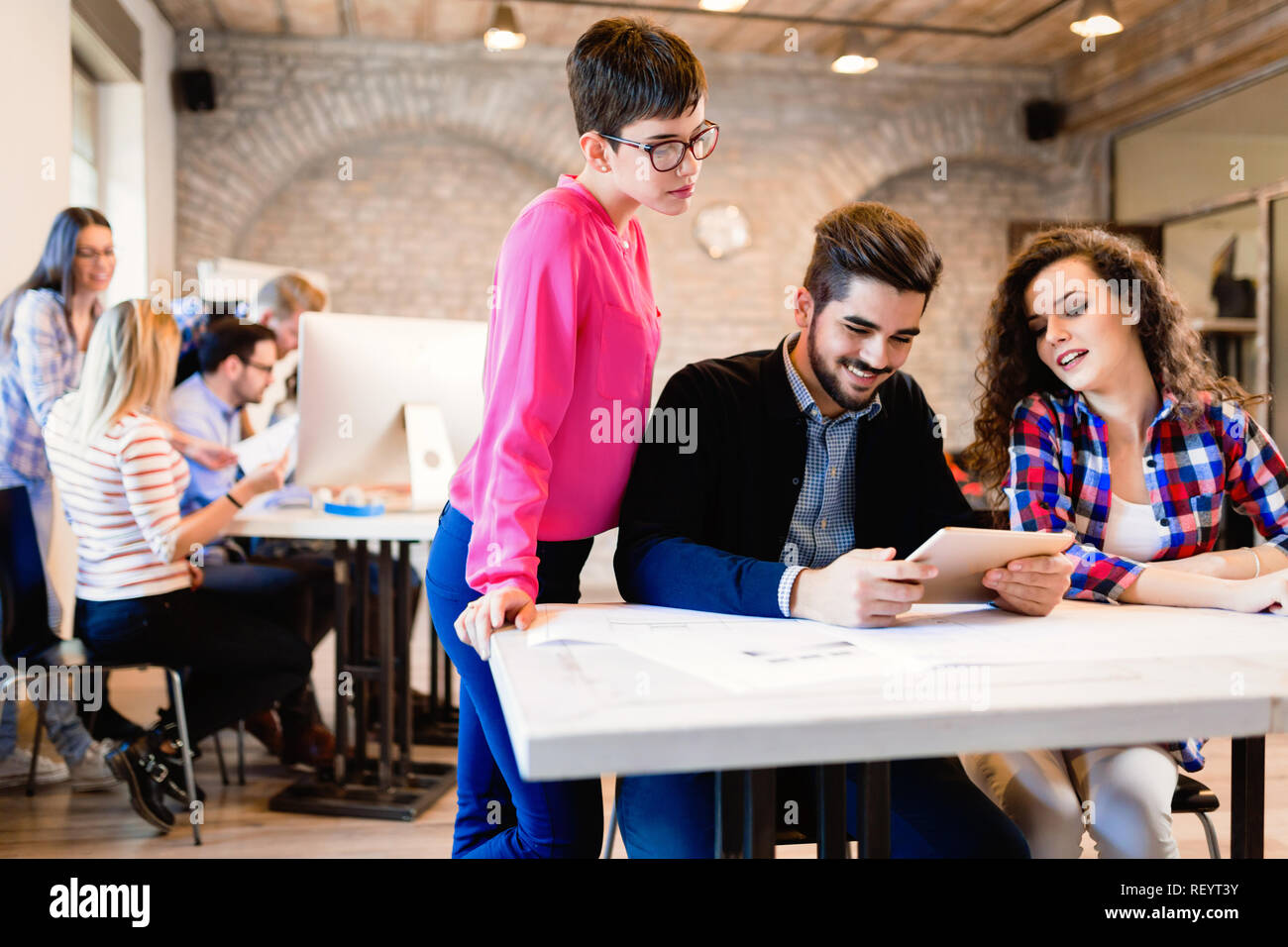 Business people and architects collaborating on project Stock Photo