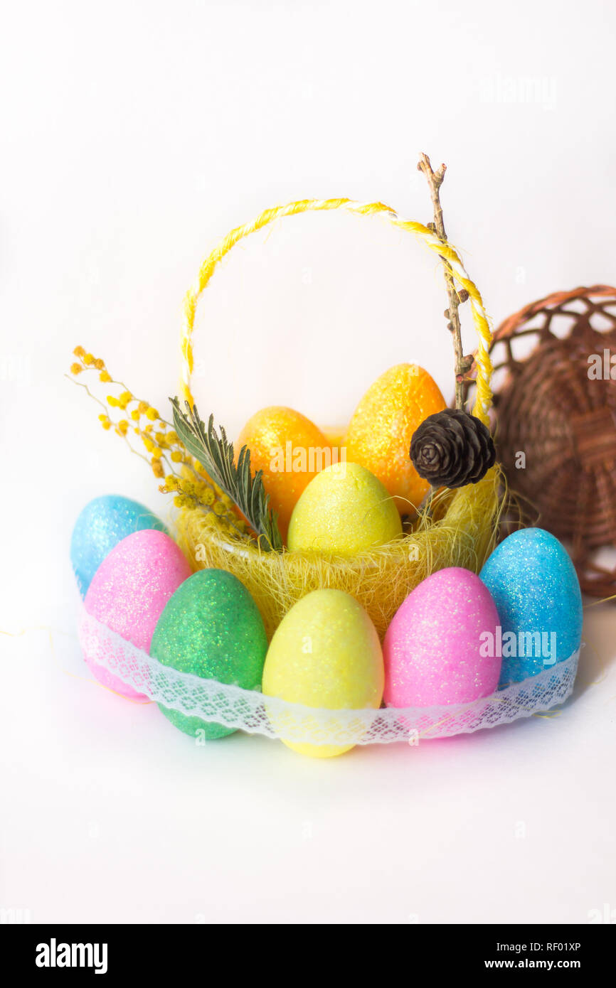 painted eggs in basket isolated on white backround. Easter eggs. Happy ...