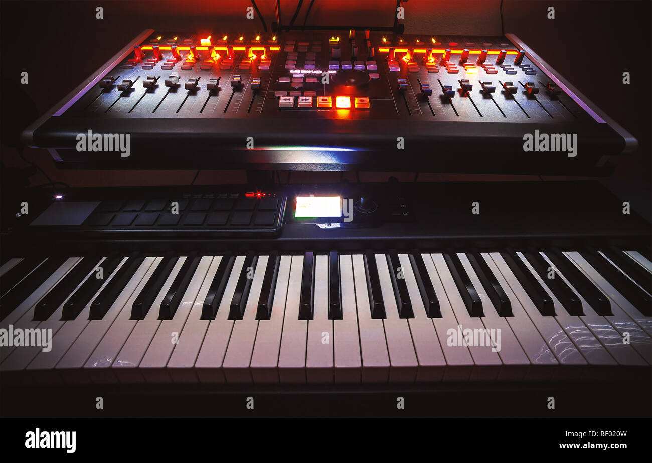 Music studio full of instruments and pc display Stock Photo - Alamy