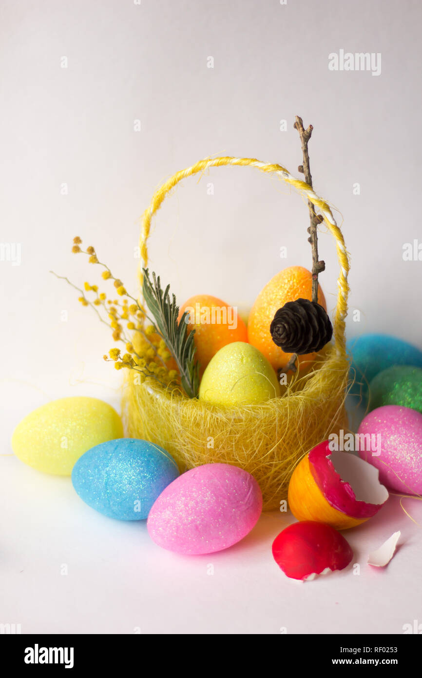 painted eggs in basket isolated on white backround. Easter eggs. Happy ...