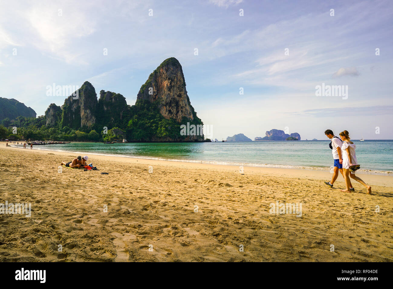 Railay Beach, Krabi, Thailand, 1st January 2019: Morning scene with long tail boats and tourists at lovely Railay beach. Stock Photo