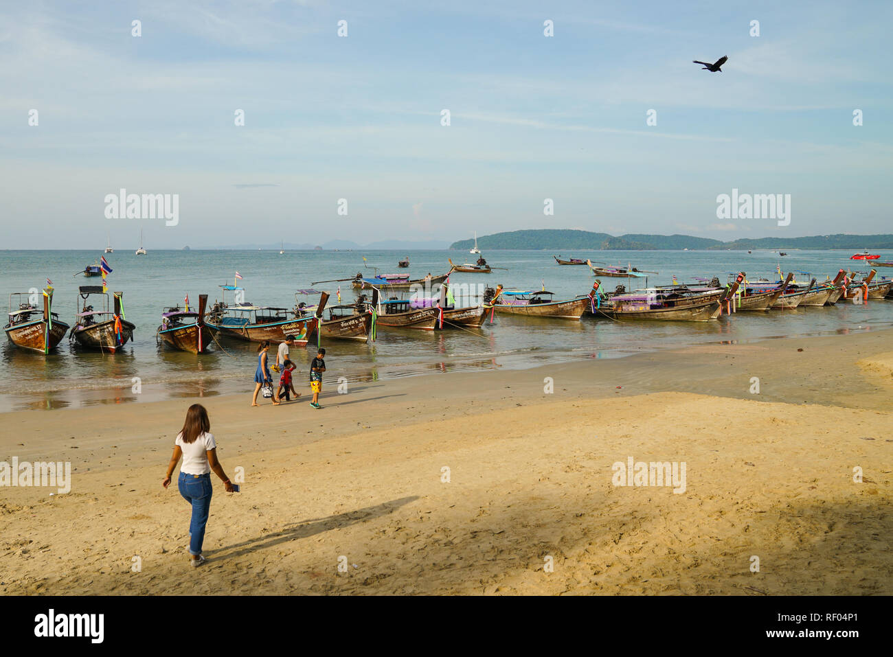 Aonang Beach, Krabi, Thailand, 1st January 2019: Morning scene with long tail boats at lovely Aonang beach. Stock Photo