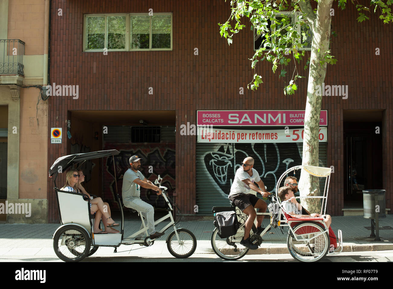 Barcelona, Spain, September. 23, 2018 A group of people riding bicycles. The city is very bike