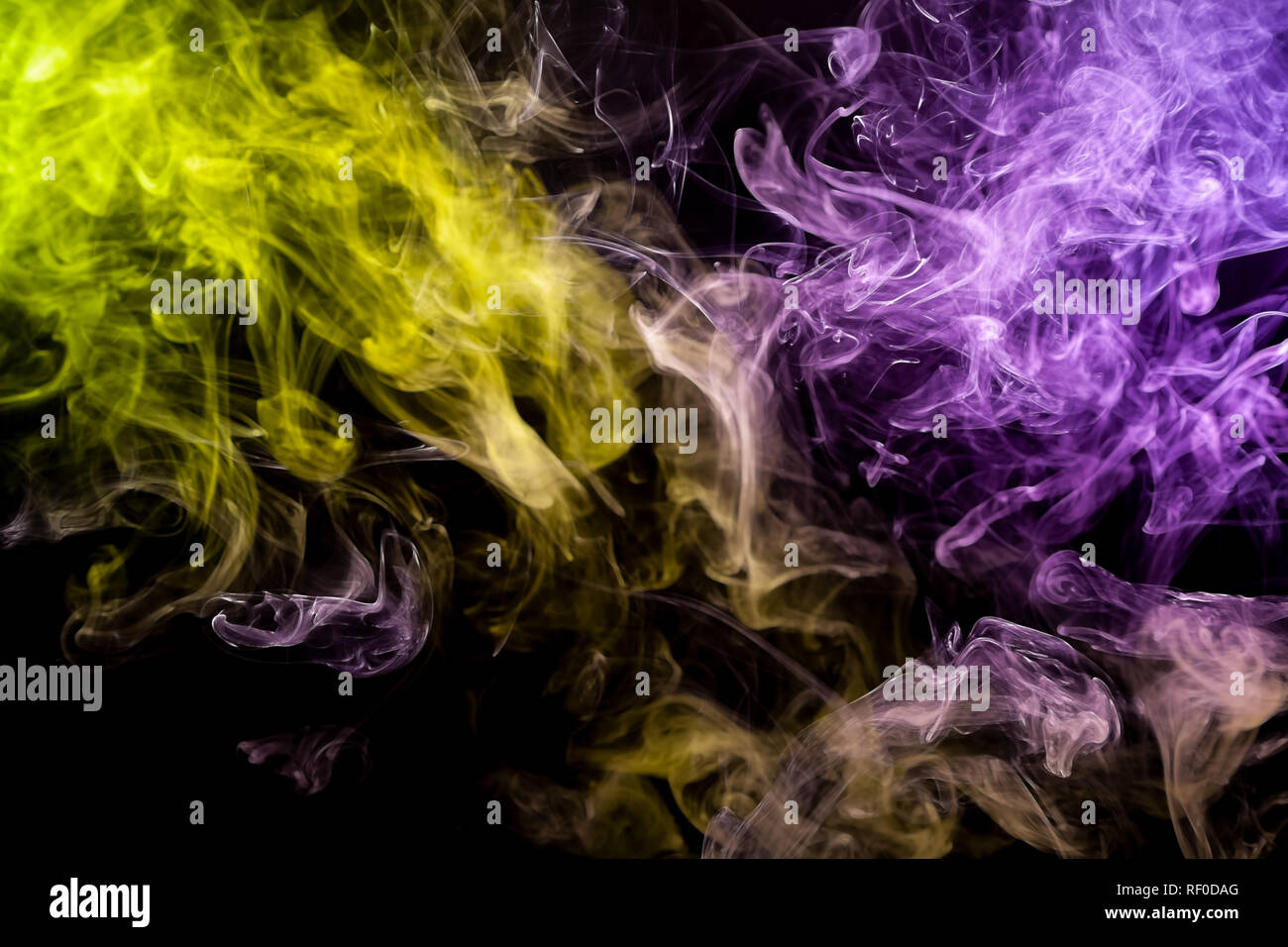 Colorful Yellow And Purple Smoke On A Black Isolated Background Background From The Smoke Of Vape Stock Photo Alamy
