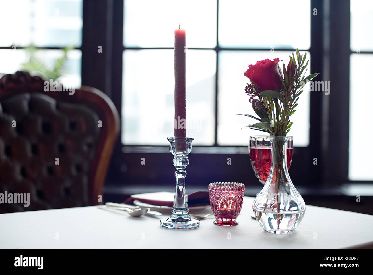 Event Table With Flower Vases Candles In A Glass Candlestick
