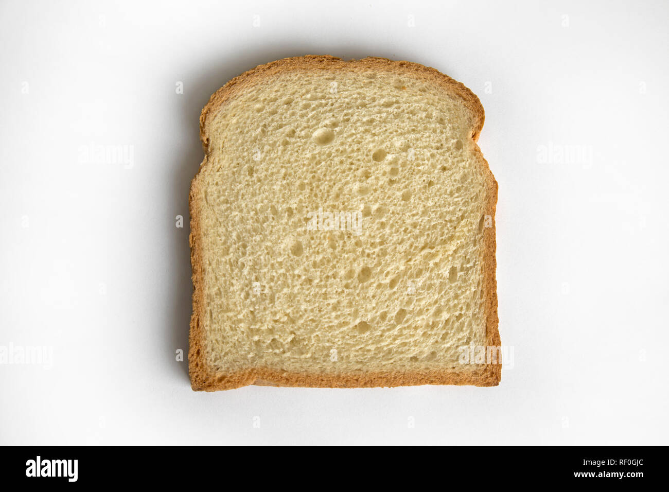 Slice of bread on white background Stock Photo - Alamy