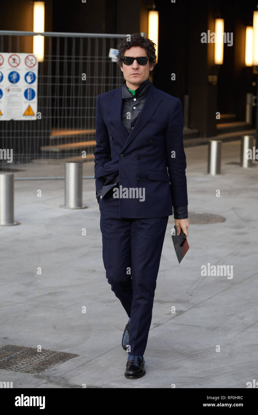 MILAN, ITALY - JANUARY 12, 2019: Man with blue suit and black shirt walking  before Neil Barrett fashion show, Milan Fashion Week street style Stock  Photo - Alamy