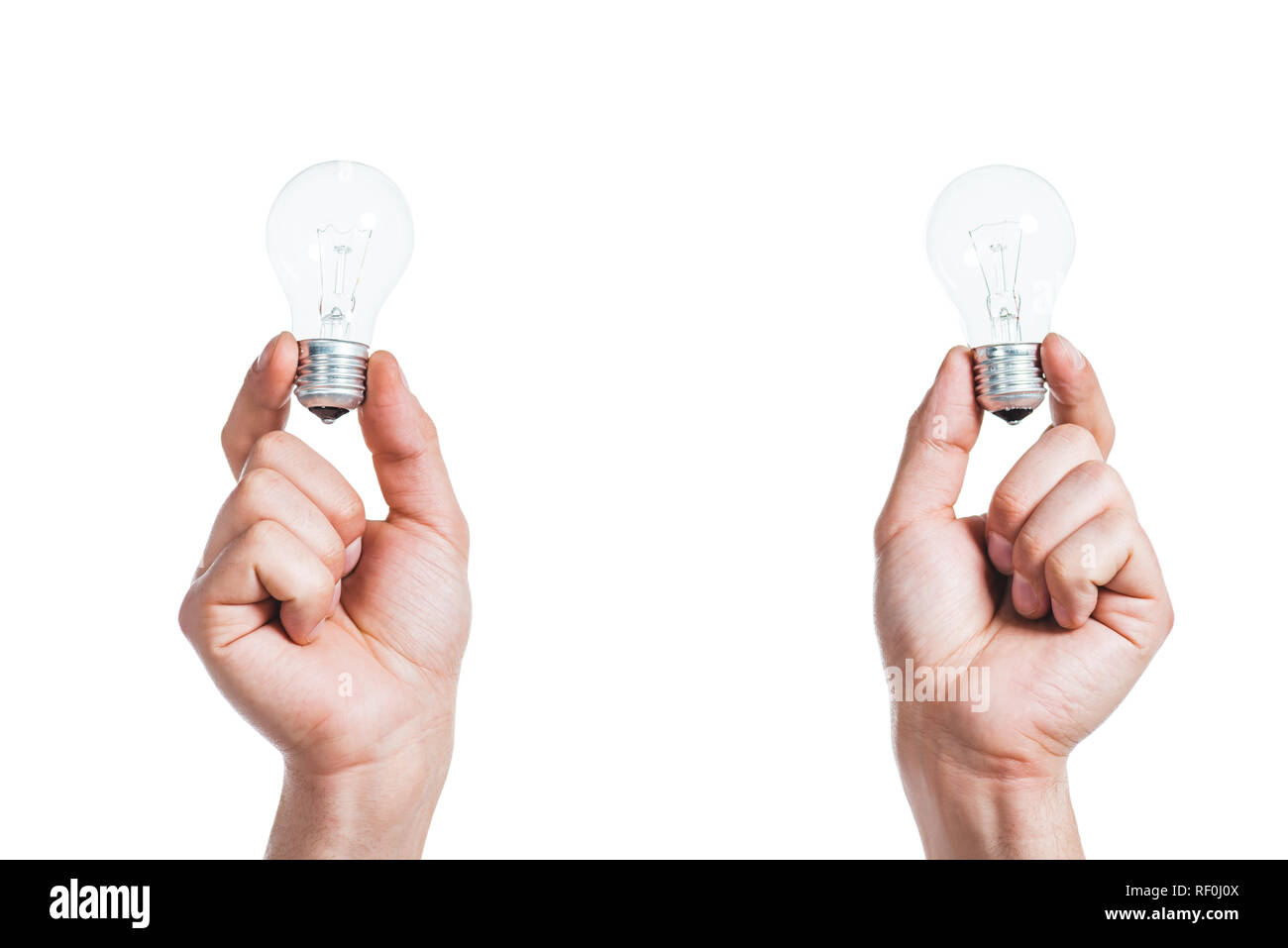 cropped view of led lamps in male hands isolated on white, energy efficiency concept Stock Photo