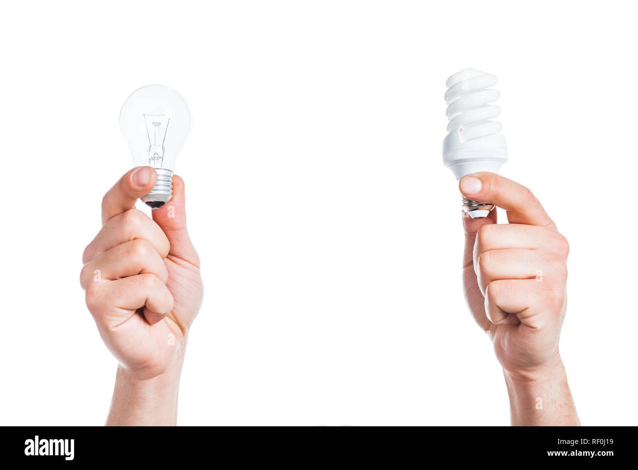 cropped view of  male hands holding led and fluorescent lamps isolated on white, energy efficiency concept Stock Photo