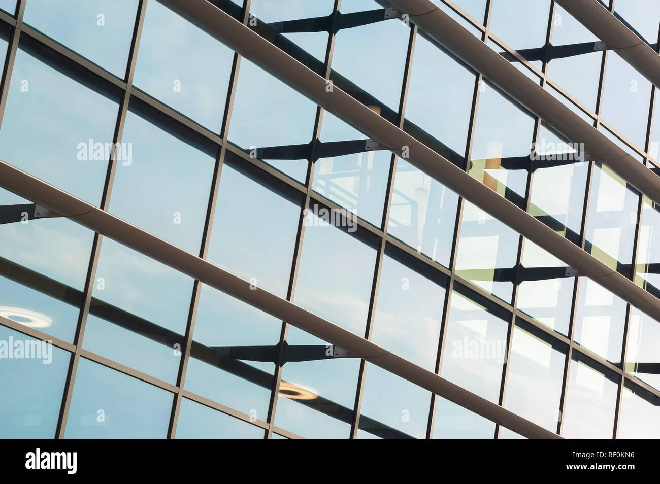 modern office block windows reflecting sunlight and blue sky Stock ...