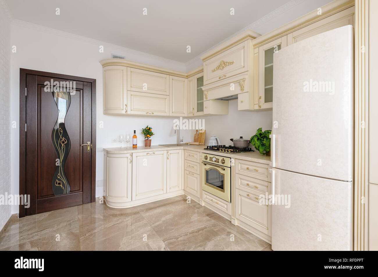 https://c8.alamy.com/comp/RF0PPT/modern-beige-colored-luxury-kitchen-RF0PPT.jpg
