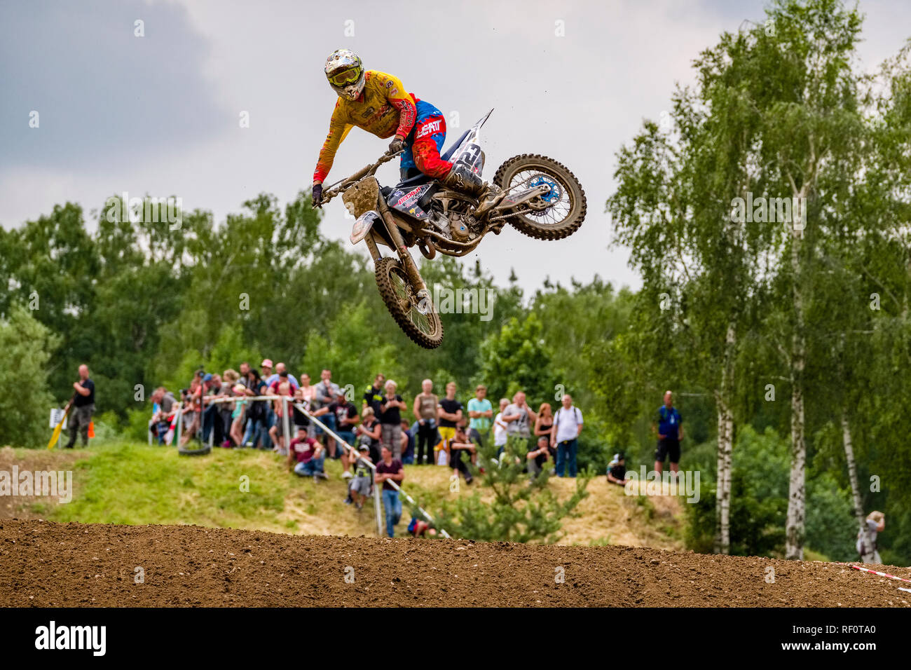 Riders on 250 cc motocross bikes jumping at Deutsche Meisterschaft at